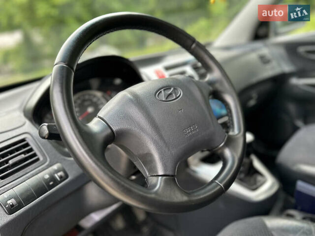 Черный Хендай Туксон, объемом двигателя 2 л и пробегом 210 тыс. км за 6600 $, фото 35 на Automoto.ua