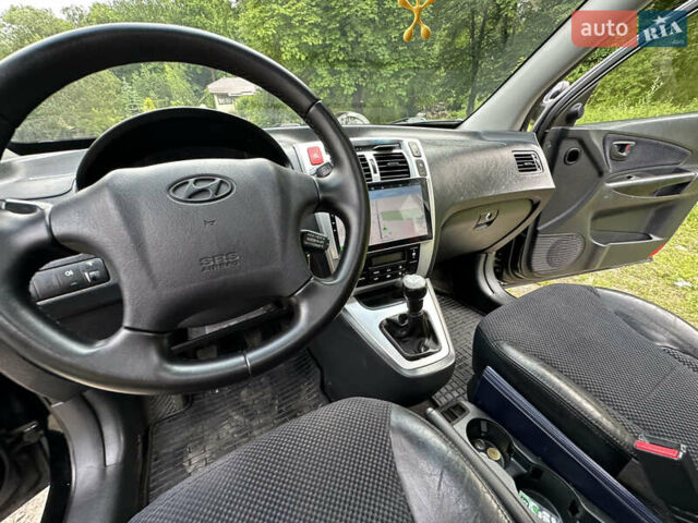 Черный Хендай Туксон, объемом двигателя 2 л и пробегом 210 тыс. км за 6600 $, фото 62 на Automoto.ua