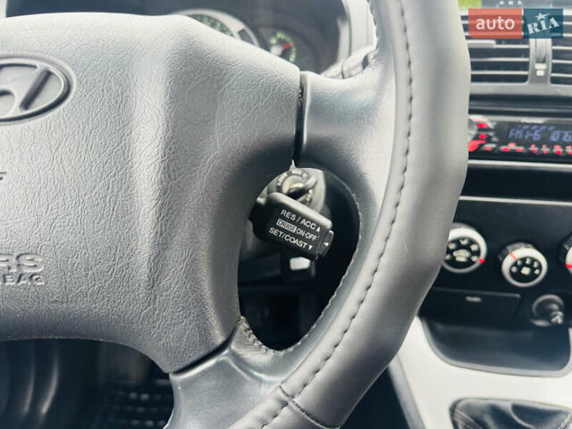 Черный Хендай Туксон, объемом двигателя 1.98 л и пробегом 252 тыс. км за 7300 $, фото 23 на Automoto.ua