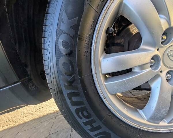 Черный Хендай Туксон, объемом двигателя 1.98 л и пробегом 226 тыс. км за 6500 $, фото 14 на Automoto.ua