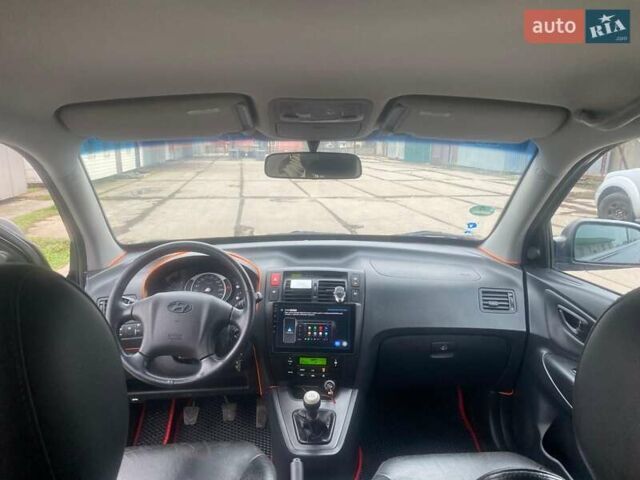 Черный Хендай Туксон, объемом двигателя 2 л и пробегом 190 тыс. км за 7500 $, фото 10 на Automoto.ua