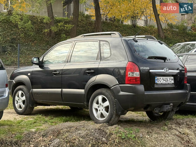 Черный Хендай Туксон, объемом двигателя 2 л и пробегом 211 тыс. км за 4444 $, фото 5 на Automoto.ua