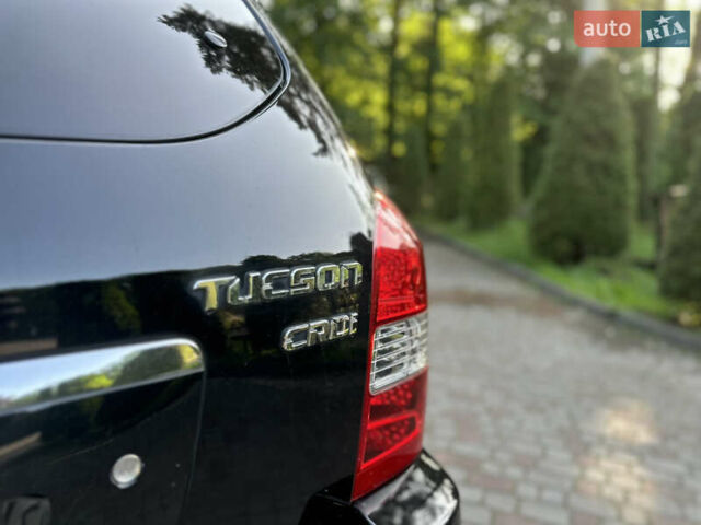 Черный Хендай Туксон, объемом двигателя 2 л и пробегом 210 тыс. км за 6600 $, фото 31 на Automoto.ua