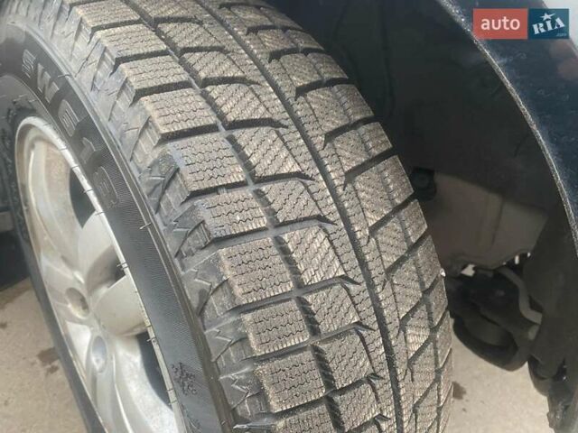 Черный Хендай Туксон, объемом двигателя 2 л и пробегом 190 тыс. км за 7500 $, фото 5 на Automoto.ua