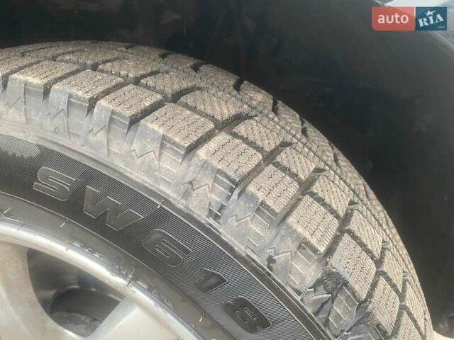 Черный Хендай Туксон, объемом двигателя 2 л и пробегом 190 тыс. км за 7500 $, фото 4 на Automoto.ua