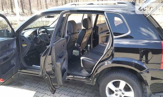 Черный Хендай Туксон, объемом двигателя 2 л и пробегом 210 тыс. км за 7000 $, фото 7 на Automoto.ua