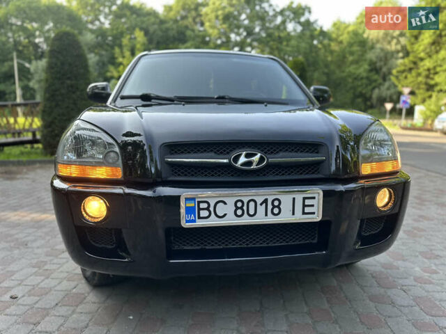Черный Хендай Туксон, объемом двигателя 2 л и пробегом 210 тыс. км за 6600 $, фото 1 на Automoto.ua