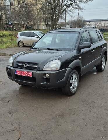 Черный Хендай Туксон, объемом двигателя 1.98 л и пробегом 230 тыс. км за 6390 $, фото 3 на Automoto.ua