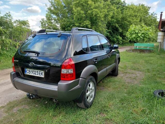 Черный Хендай Туксон, объемом двигателя 2 л и пробегом 238 тыс. км за 8200 $, фото 3 на Automoto.ua
