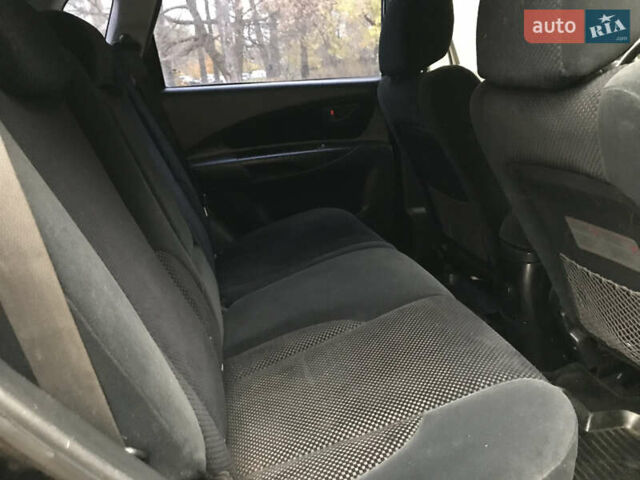 Черный Хендай Туксон, объемом двигателя 2 л и пробегом 261 тыс. км за 6500 $, фото 21 на Automoto.ua