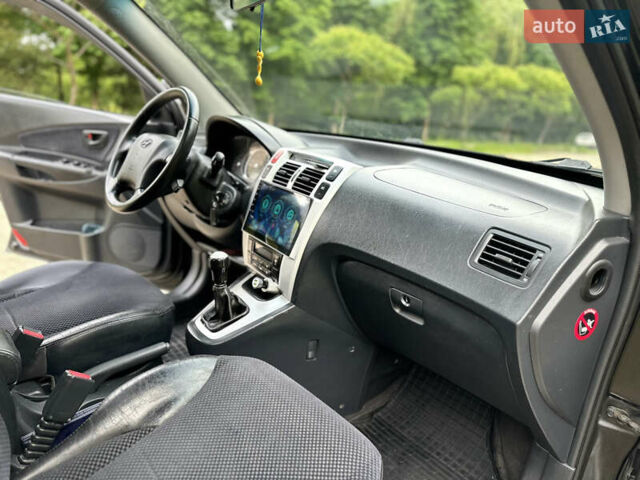 Черный Хендай Туксон, объемом двигателя 2 л и пробегом 210 тыс. км за 6600 $, фото 46 на Automoto.ua