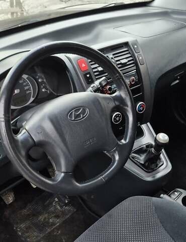 Черный Хендай Туксон, объемом двигателя 1.98 л и пробегом 230 тыс. км за 6390 $, фото 20 на Automoto.ua