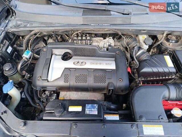 Черный Хендай Туксон, объемом двигателя 1.98 л и пробегом 285 тыс. км за 5600 $, фото 24 на Automoto.ua