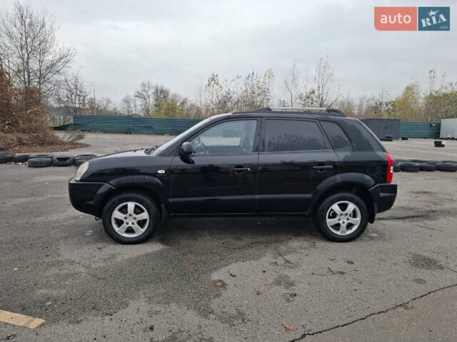 Черный Хендай Туксон, объемом двигателя 2 л и пробегом 170 тыс. км за 6999 $, фото 1 на Automoto.ua