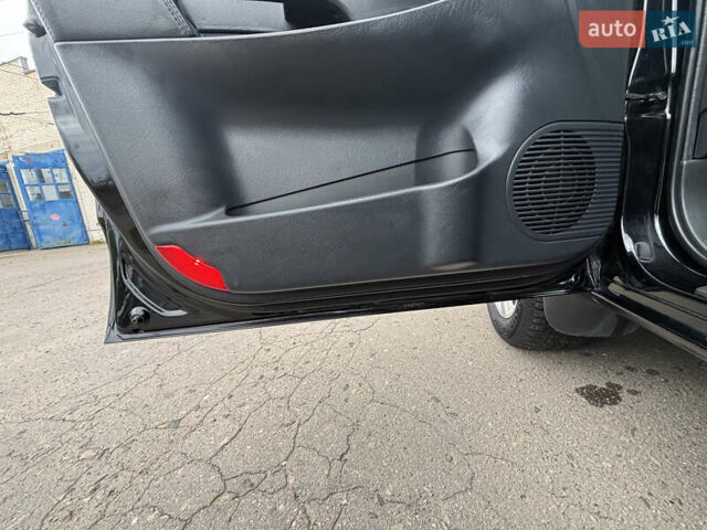 Черный Хендай Туксон, объемом двигателя 1.98 л и пробегом 215 тыс. км за 8600 $, фото 13 на Automoto.ua