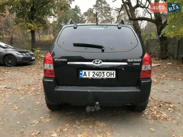 Черный Хендай Туксон, объемом двигателя 2 л и пробегом 261 тыс. км за 6500 $, фото 7 на Automoto.ua