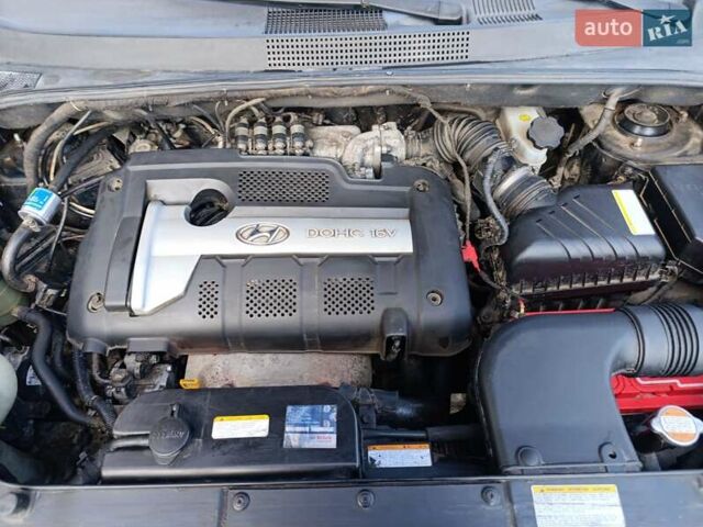 Черный Хендай Туксон, объемом двигателя 1.98 л и пробегом 285 тыс. км за 5600 $, фото 23 на Automoto.ua