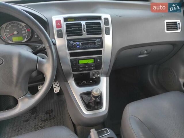 Черный Хендай Туксон, объемом двигателя 2 л и пробегом 208 тыс. км за 6950 $, фото 22 на Automoto.ua