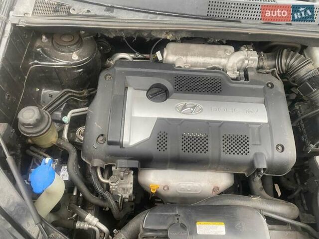 Черный Хендай Туксон, объемом двигателя 2 л и пробегом 190 тыс. км за 7500 $, фото 19 на Automoto.ua