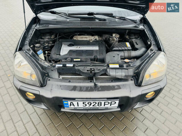 Черный Хендай Туксон, объемом двигателя 1.98 л и пробегом 252 тыс. км за 7300 $, фото 26 на Automoto.ua