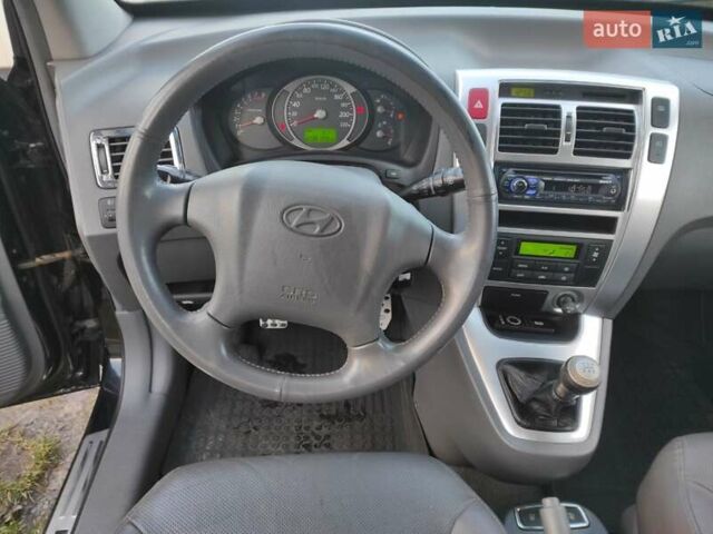 Черный Хендай Туксон, объемом двигателя 2 л и пробегом 208 тыс. км за 6950 $, фото 21 на Automoto.ua