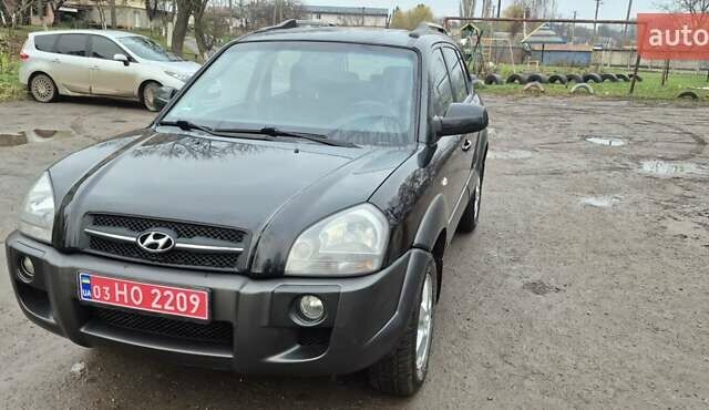 Черный Хендай Туксон, объемом двигателя 1.98 л и пробегом 230 тыс. км за 6390 $, фото 27 на Automoto.ua