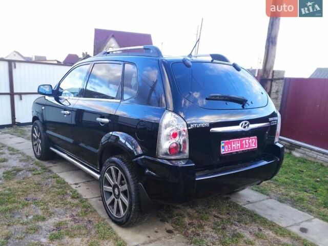 Черный Хендай Туксон, объемом двигателя 2 л и пробегом 208 тыс. км за 6950 $, фото 41 на Automoto.ua
