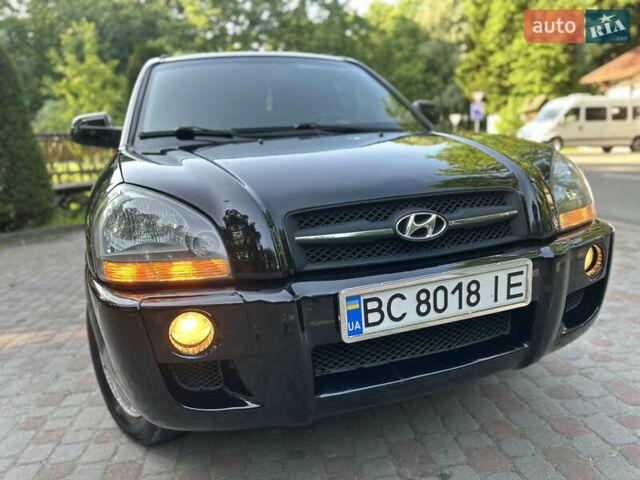 Черный Хендай Туксон, объемом двигателя 2 л и пробегом 210 тыс. км за 6600 $, фото 2 на Automoto.ua