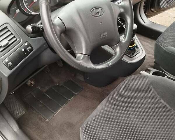 Черный Хендай Туксон, объемом двигателя 1.99 л и пробегом 250 тыс. км за 6650 $, фото 6 на Automoto.ua