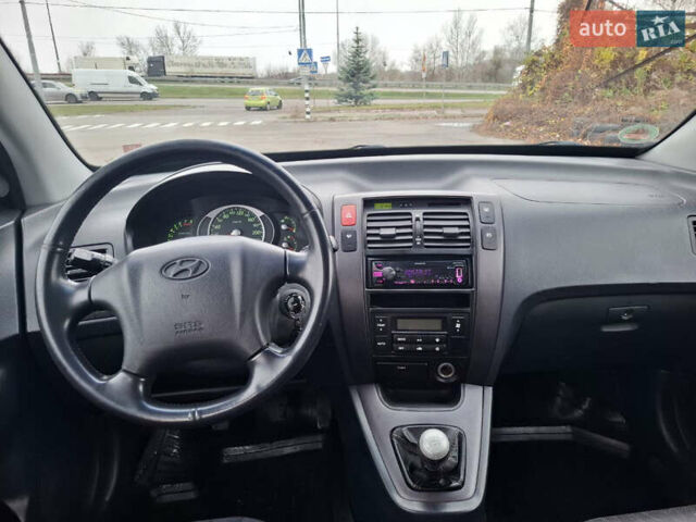 Черный Хендай Туксон, объемом двигателя 2 л и пробегом 170 тыс. км за 6999 $, фото 10 на Automoto.ua