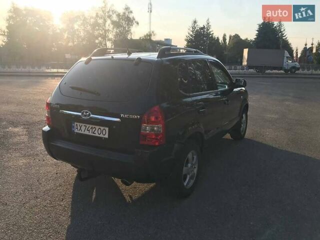 Черный Хендай Туксон, объемом двигателя 2 л и пробегом 253 тыс. км за 7500 $, фото 3 на Automoto.ua