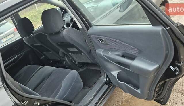 Черный Хендай Туксон, объемом двигателя 1.98 л и пробегом 230 тыс. км за 6390 $, фото 22 на Automoto.ua