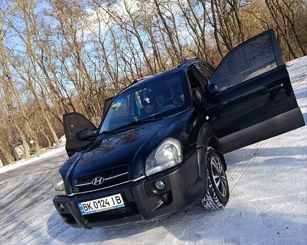 Черный Хендай Туксон, объемом двигателя 1.98 л и пробегом 285 тыс. км за 5600 $, фото 12 на Automoto.ua