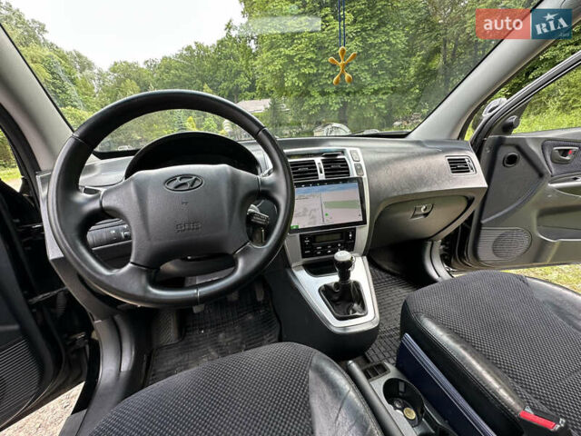 Черный Хендай Туксон, объемом двигателя 2 л и пробегом 210 тыс. км за 6600 $, фото 66 на Automoto.ua