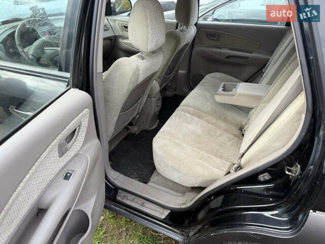 Черный Хендай Туксон, объемом двигателя 2 л и пробегом 211 тыс. км за 4444 $, фото 10 на Automoto.ua