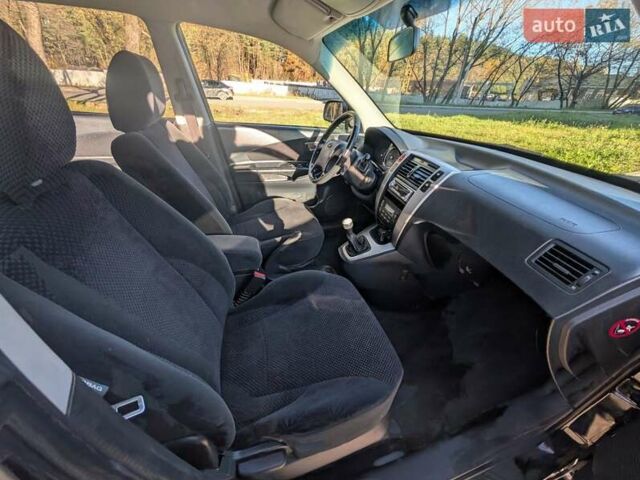 Черный Хендай Туксон, объемом двигателя 1.98 л и пробегом 226 тыс. км за 6500 $, фото 7 на Automoto.ua