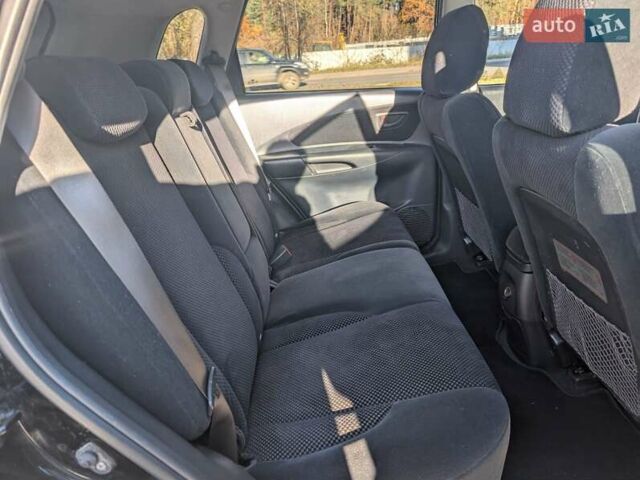 Черный Хендай Туксон, объемом двигателя 1.98 л и пробегом 226 тыс. км за 6500 $, фото 3 на Automoto.ua