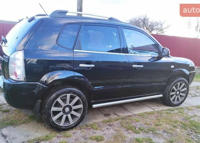 Черный Хендай Туксон, объемом двигателя 2 л и пробегом 208 тыс. км за 6950 $, фото 56 на Automoto.ua