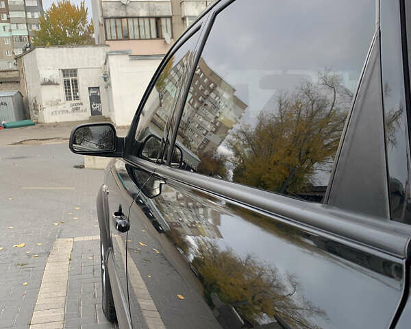 Черный Хендай Туксон, объемом двигателя 2 л и пробегом 219 тыс. км за 8400 $, фото 7 на Automoto.ua