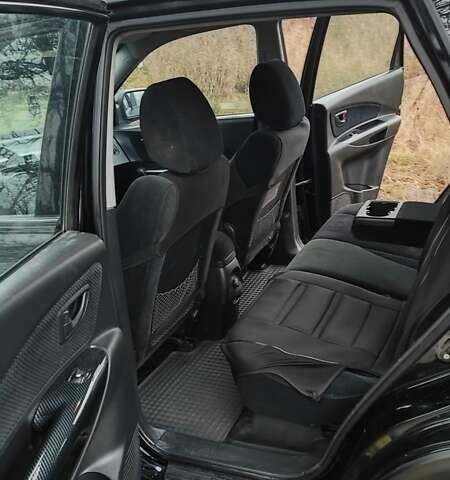 Черный Хендай Туксон, объемом двигателя 2 л и пробегом 284 тыс. км за 4700 $, фото 13 на Automoto.ua