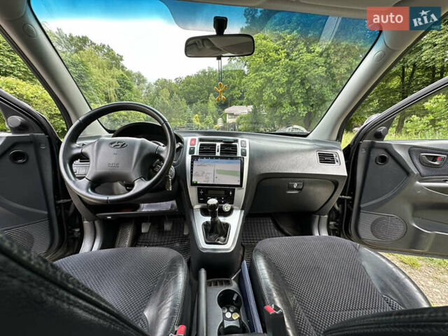 Черный Хендай Туксон, объемом двигателя 2 л и пробегом 210 тыс. км за 6600 $, фото 58 на Automoto.ua