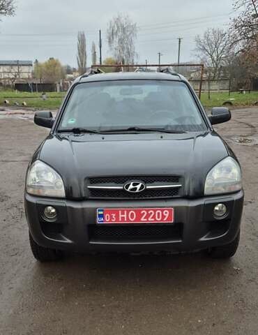 Черный Хендай Туксон, объемом двигателя 1.98 л и пробегом 230 тыс. км за 6390 $, фото 1 на Automoto.ua