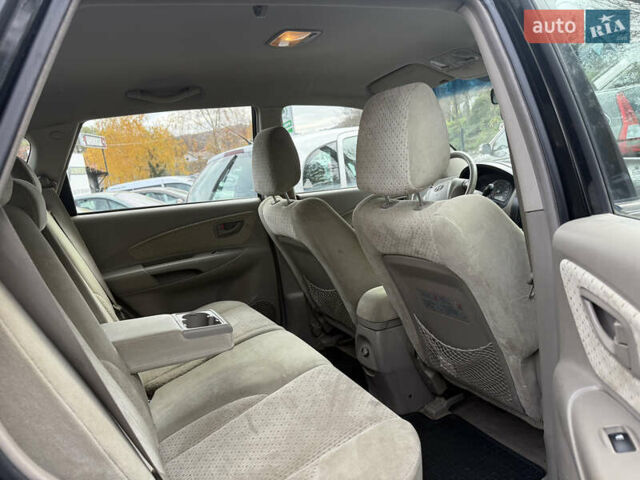 Черный Хендай Туксон, объемом двигателя 2 л и пробегом 211 тыс. км за 4444 $, фото 17 на Automoto.ua