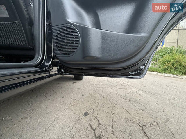 Черный Хендай Туксон, объемом двигателя 1.98 л и пробегом 215 тыс. км за 8600 $, фото 10 на Automoto.ua