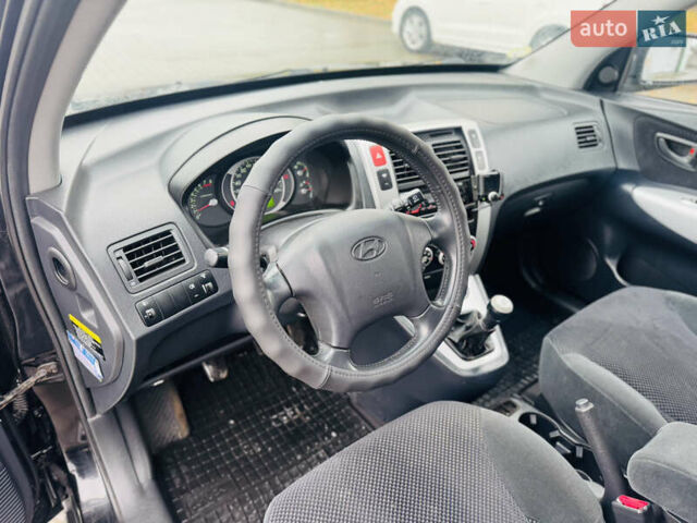 Черный Хендай Туксон, объемом двигателя 1.98 л и пробегом 252 тыс. км за 7300 $, фото 16 на Automoto.ua