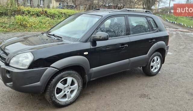 Черный Хендай Туксон, объемом двигателя 1.98 л и пробегом 230 тыс. км за 6390 $, фото 28 на Automoto.ua