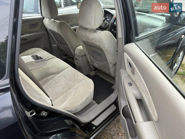 Черный Хендай Туксон, объемом двигателя 2 л и пробегом 211 тыс. км за 4444 $, фото 16 на Automoto.ua