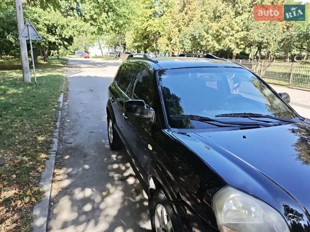 Черный Хендай Туксон, объемом двигателя 2 л и пробегом 247 тыс. км за 6300 $, фото 5 на Automoto.ua