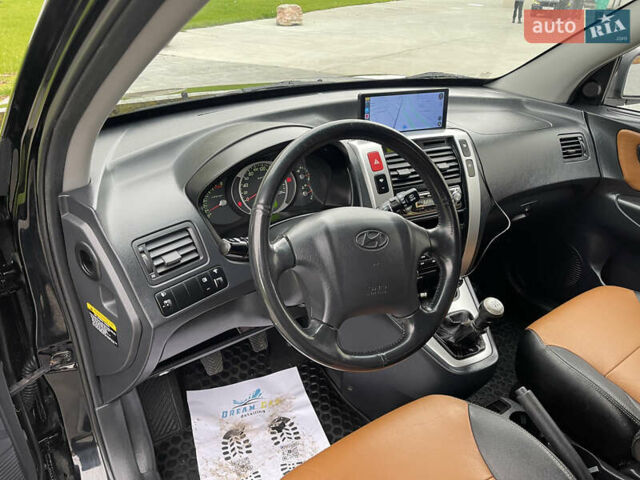 Черный Хендай Туксон, объемом двигателя 2 л и пробегом 216 тыс. км за 7500 $, фото 18 на Automoto.ua