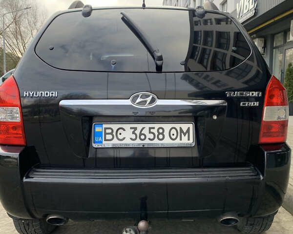 Черный Хендай Туксон, объемом двигателя 1.99 л и пробегом 290 тыс. км за 7700 $, фото 4 на Automoto.ua